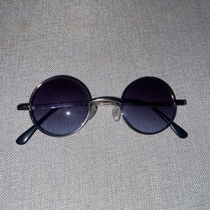 Small circled glasses with blue tint